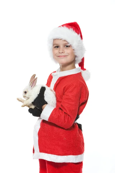 男孩抱着一只圣诞兔子 — 图库照片