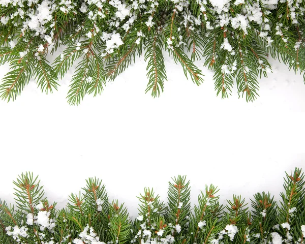 Marco navideño con nieve aislada sobre fondo blanco Imagen De Stock