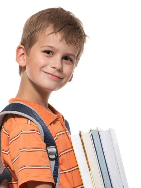 Niño sosteniendo libros — Foto de Stock