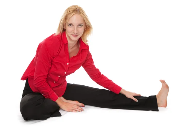 Het beoefenen van yoga. jonge zakenvrouw Stockfoto