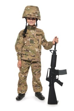 Young boy dressed like a soldier with rifle isolated on white clipart