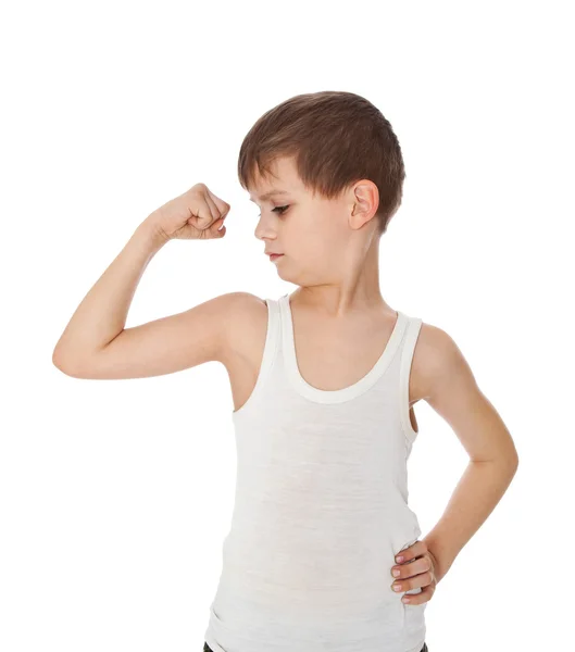 Chlapec ukazuje jeho svalů — Stock fotografie