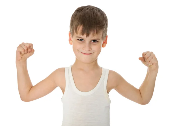Junge zeigt seine Muskeln — Stockfoto