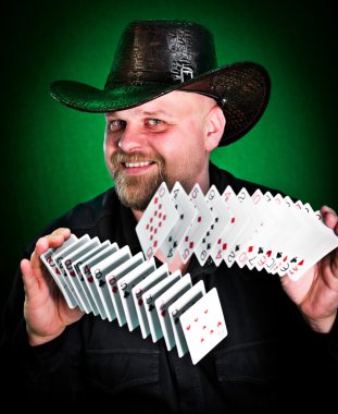 Man skilfully shuffles playing cards... clipart