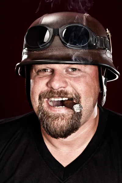 Biker Helmet Smokes Cigar Dark Background — Stock Photo, Image