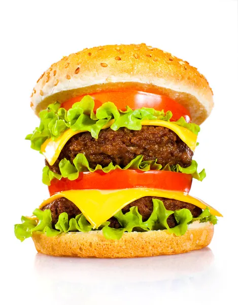 Sabrosa y apetitosa hamburguesa sobre un blanco — Foto de Stock