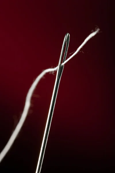 Needle Thread Darkly Red Background — Stock Photo, Image