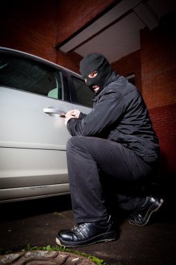 Robber and the thief hijacks the car clipart