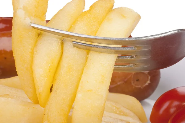 Patata frita en un tenedor —  Fotos de Stock