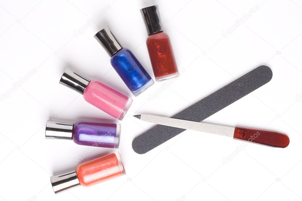 Nail polish and nail files placed on a white background.