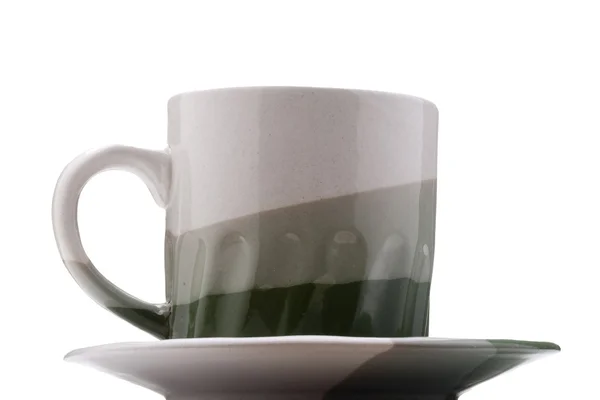 セラミックのマグカップとソーサーは灰色がかった緑のホットド リンク — ストック写真