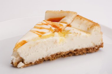 Cheesecake stuffed with lemon, peach, wild berry and strowberry. clipart