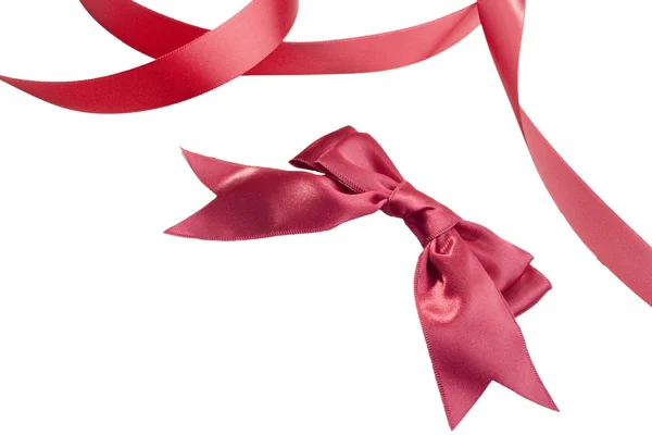 弓と白い背景に暗く赤い色のテープ — ストック写真