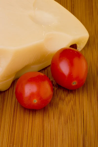 Cheese slice and red tomato — Stock Photo, Image