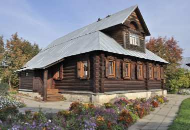 Beautiful wooden house with flowers, autumn clipart