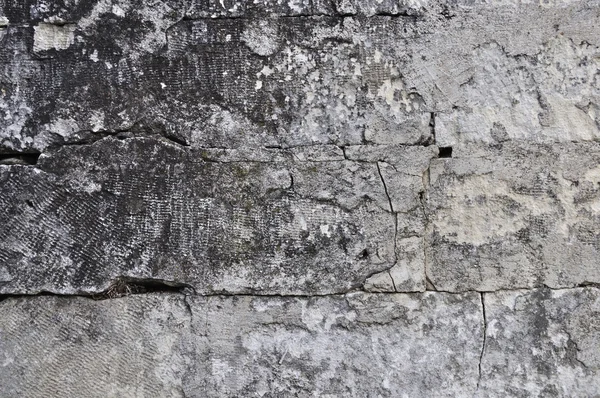 Ruwe grijze stenen muur achtergrond — Stockfoto