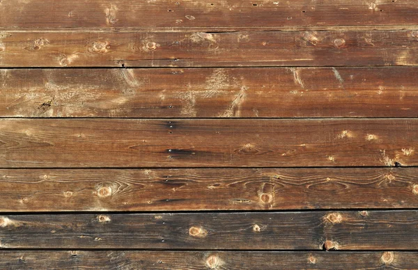 自然茶色の風化させた木の板の背景のクローズ アップ — ストック写真