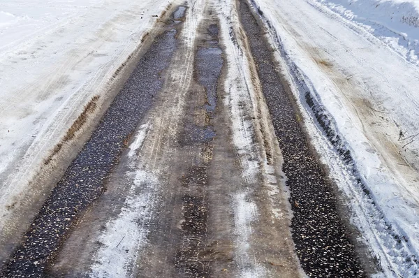 Asphalt road with snow — Stock Photo, Image