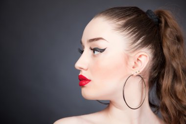 Portrait of girl with red lips and black eyeliner clipart
