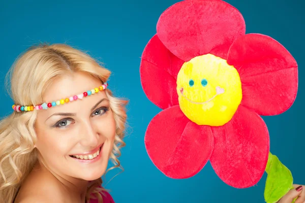 Smiling woman and flower — Stock Photo, Image
