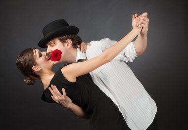 Professional dancers, girl holding rose in mouth clipart