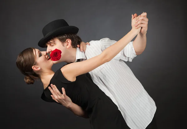 Professional dancers, girl holding rose in mouth — Stock Photo, Image