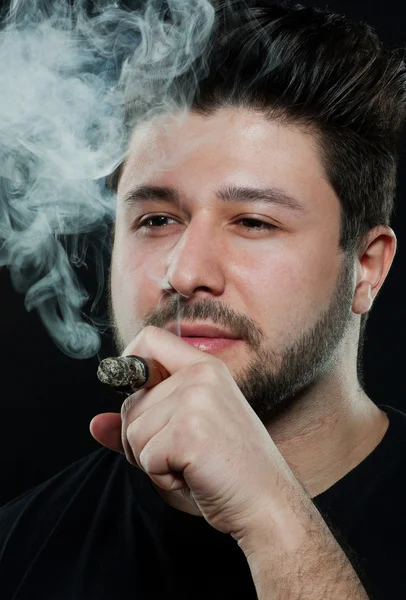 stock image Smoking cigar young man