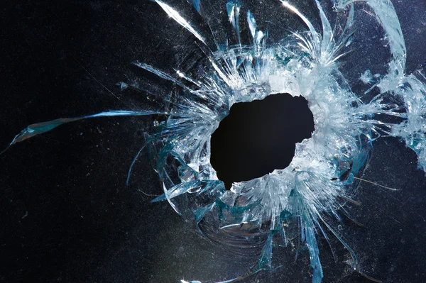 A bullet hole is in glass — Stock Photo, Image