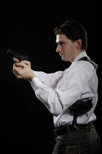 Foto yuong homem com arma — Fotografia de Stock