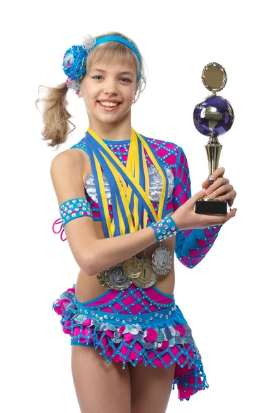 Beautiful young girl gymnast with a cup in hands — Stock Photo, Image