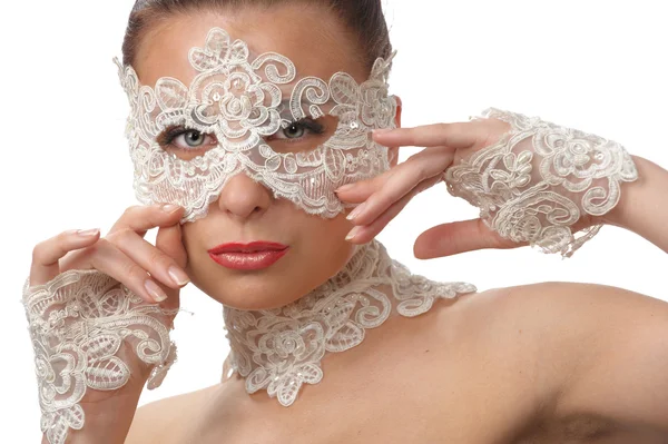 Vacker kvinna med anbud ansikte i spets mask över hennes ögon Stockfoto