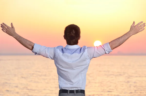 stock image Businessman at sea sunrise