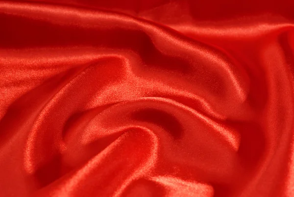 Close-up se um tecido de seda vermelha — Fotografia de Stock