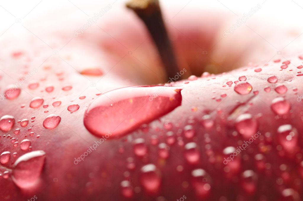 Red wet apple with big droplet, macro shot