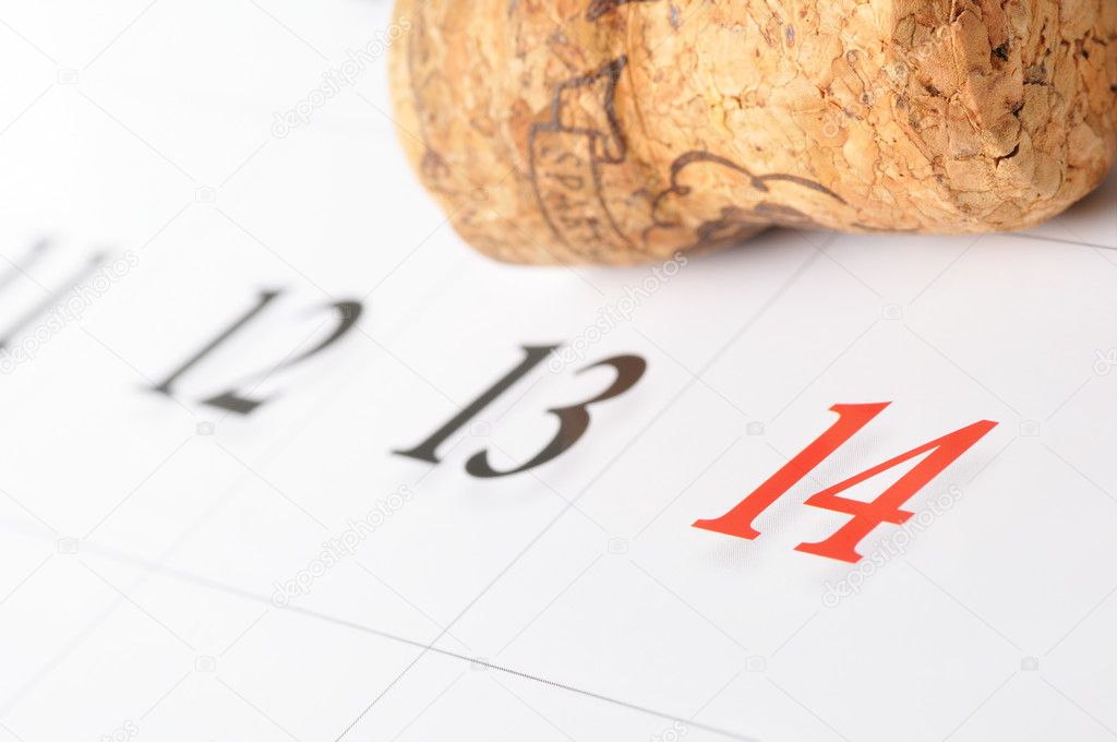 Calendar with red fourteen number and champagne cork
