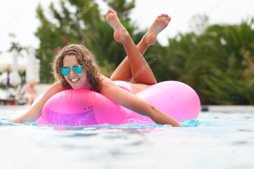 Woman on pink air bed