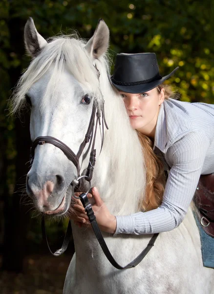 Young Lady hugging her horse — Stock Photo, Image
