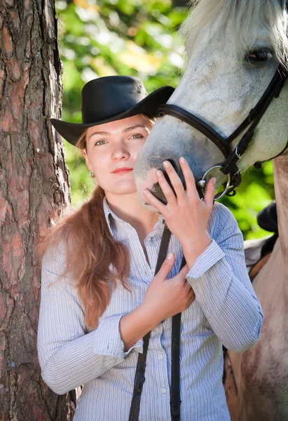 Young Lady hugging her horse — Stock Photo, Image
