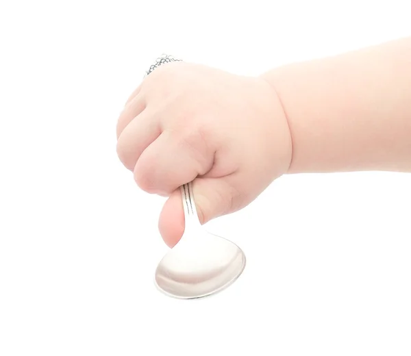 スプーンを持っている赤ちゃんの手 — ストック写真