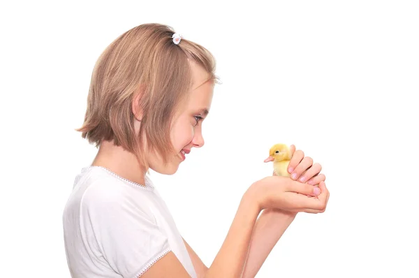 Girl holding a duckling Stock Picture