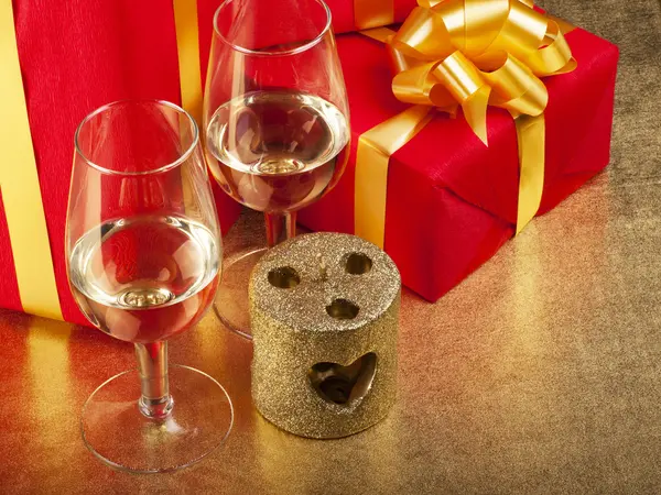 stock image Two glasses and box with gifts