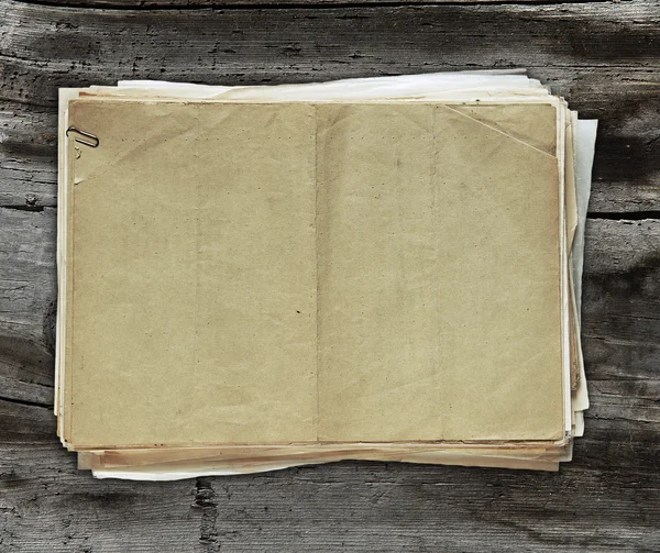 Old papers on wooden background — Stock Photo, Image