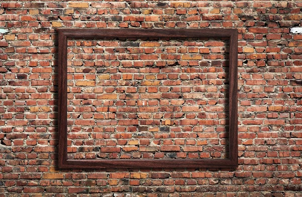 Fotoramme på murstensvæg - Stock-foto
