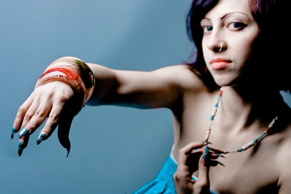 stock image Young woman with artistic manicure and bracelets.