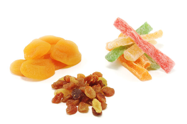 Dried apricots, raisins, candied fruit isolated on white background