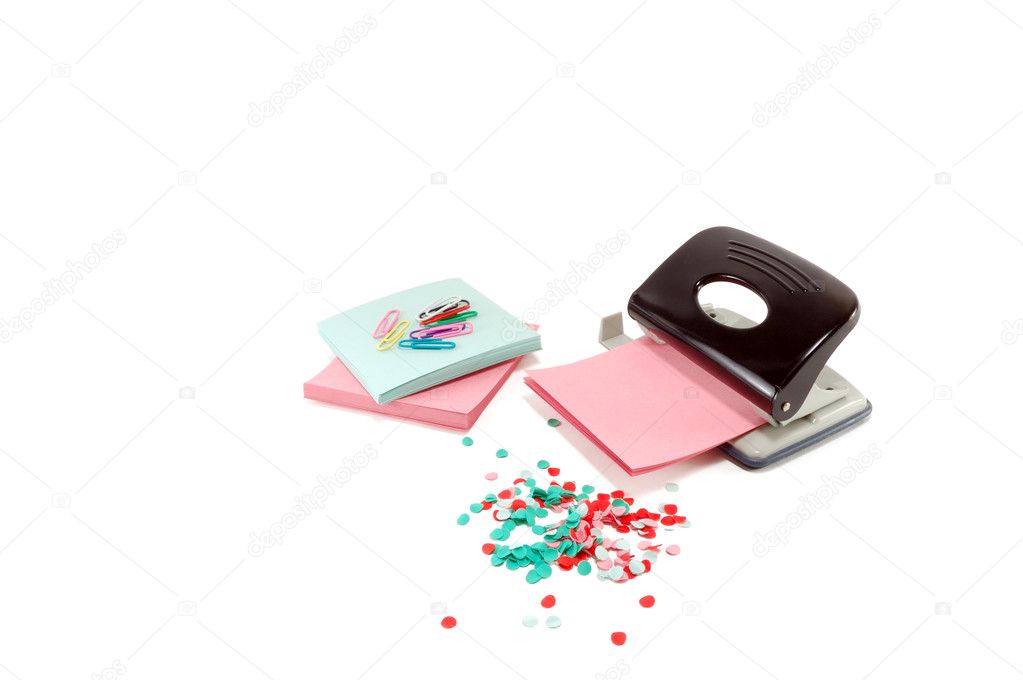 The puncher with a paper is isolated on a white background