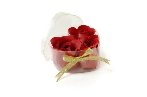 Poupata růží z látky v průhledné krabičce — Stock fotografie