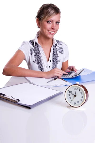 Businesswoman sitting with calculator Stock Photo