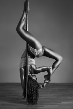 Young sexy pole dance woman. Contrast black and white colors. clipart