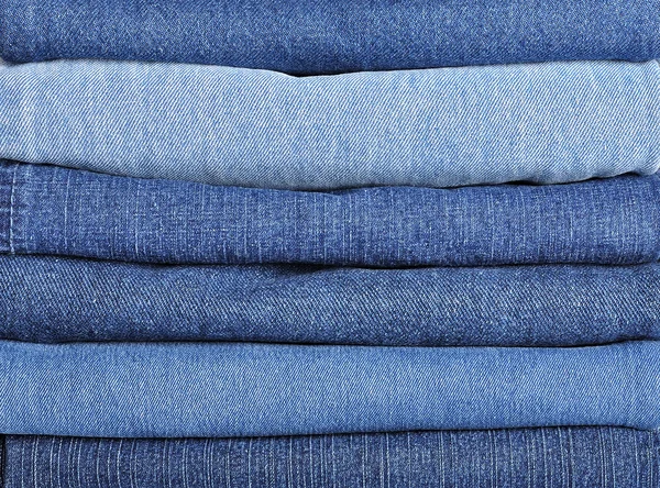 Jeans empilhar fundo — Fotografia de Stock